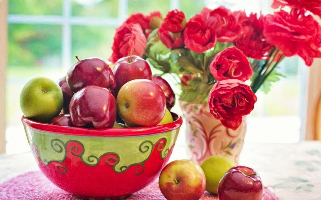 A bowl of mixed berries on ice